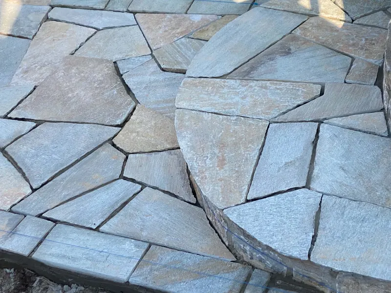 Grey ochre flagstone curved raised patio step — PelionStones.gr