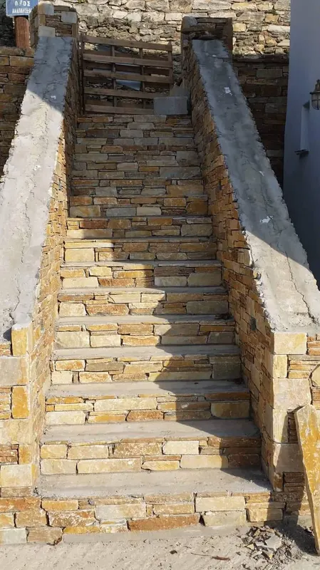 Ochre gold stone stairs Wandverkleidung construction — PelionStones.gr